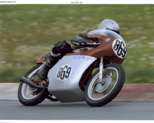 MV Agusta 350B Elettronica  owner / racer John Lawless on the  1973 MV Agusta 350 at Mid-Ohio in 2002. 